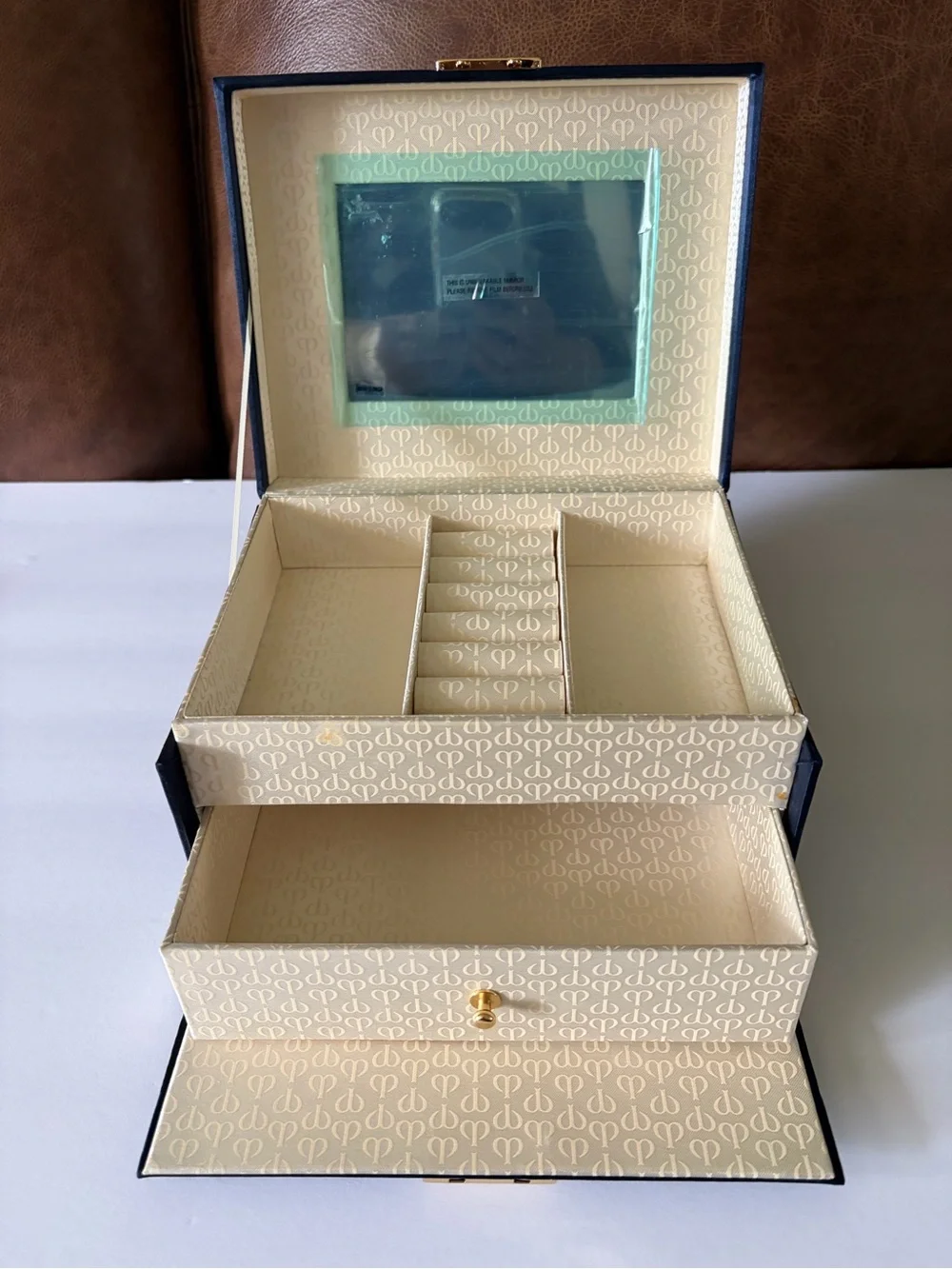 NWOT Cle’ de Peau elegant blue satin small/travel jewelry box. Mirror. Drawer